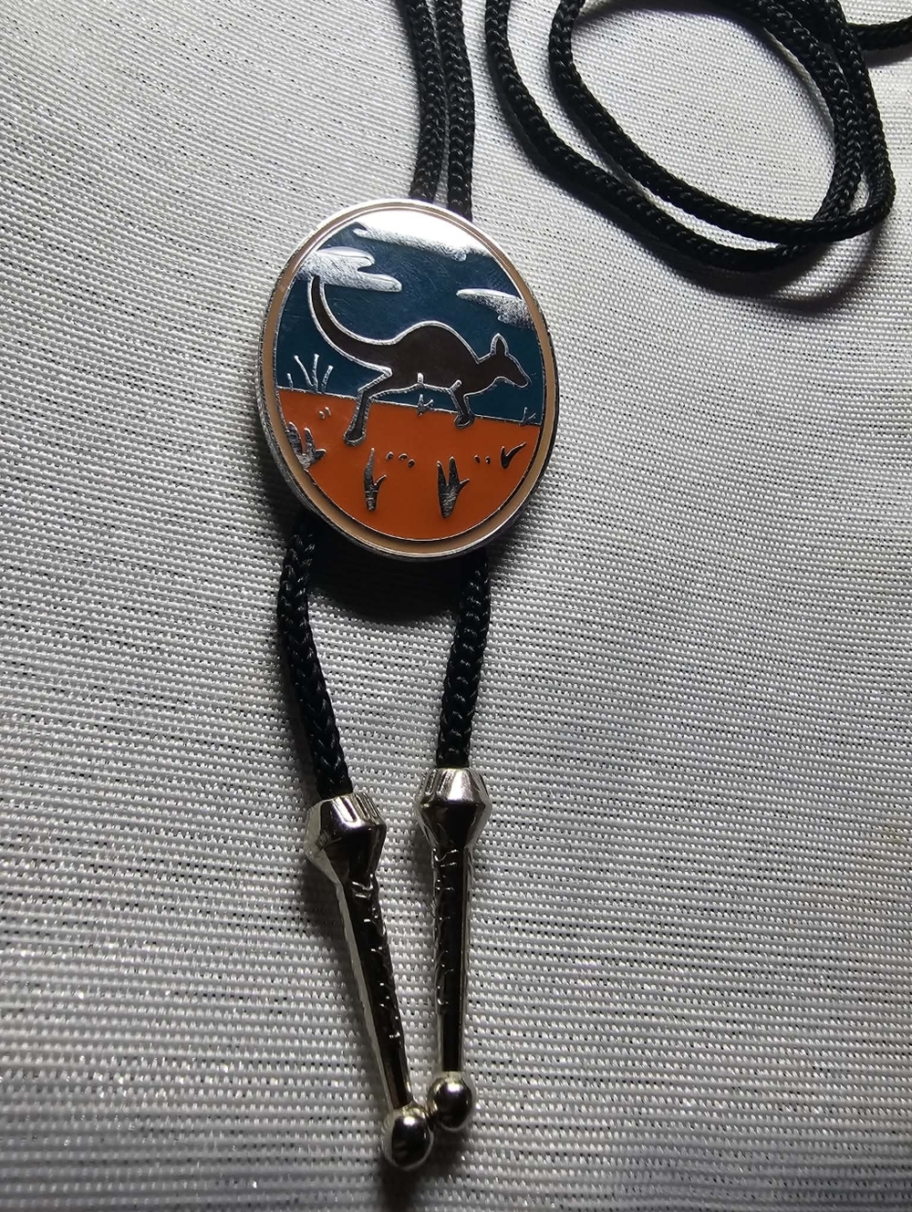 Australian Kangaroo Enamel Bolo Tie – Black Cord with Orange & Teal Medal